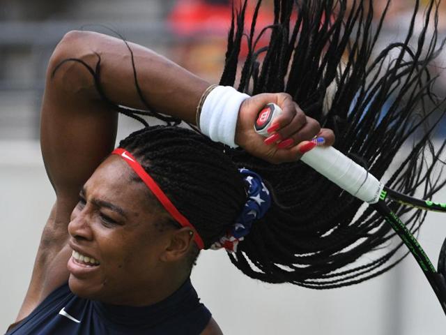 Serena Williams is seeking to be the first tennis player to win back-to-back Olympics singles gold. On Sunday, she beat Australia's Daria Gavrilova 6-4, 6-2 in the first round. (Roberto Schmidt/AFP)