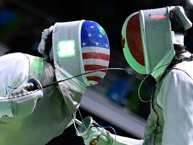 US Gerek Meinhardt (L) competes against Canada's Maximilien Van Haaster during their men’s individual foil qualifying bout as part of the fencing event. (AFP Photo) US Gerek Meinhardt (L) competes against Canada's Maximilien Van Haaster during their men’s individual foil qualifying bout as part of the fencing event. (AFP Photo)