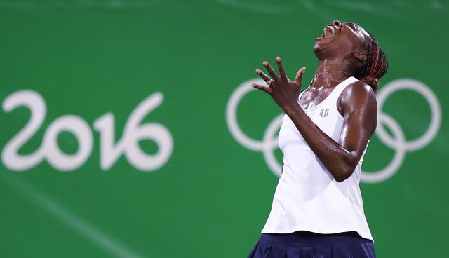 Venus Williams reacts after losing a point in the doubles match with her sister Serena against Lucie Safarova and Barbora Strycova of the Czech Republic in Rio de Janeiro on Sunday. (AP) Venus Williams reacts after losing a point in the doubles match with her sister Serena against Lucie Safarova and Barbora Strycova of the Czech Republic in Rio de Janeiro on Sunday. (AP)