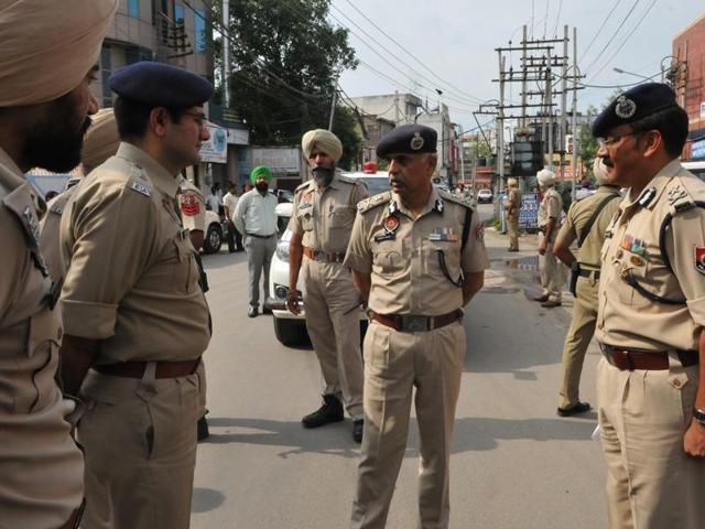 DGP Suresh Arora with police officials at the crime spot in Jalandhar on Sunday. (HT File Photo)