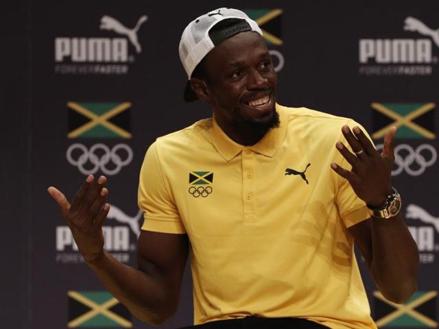 Usain Bolt with Brazilian samba dancers .(REUTERS photo) Usain Bolt with Brazilian samba dancers .(REUTERS photo)