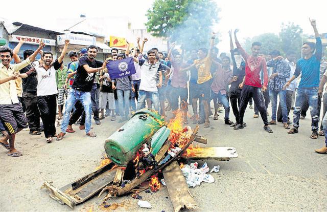 Members of Dalit Community block the traffic during a protest in Ahmedabad. (PTI Photo)