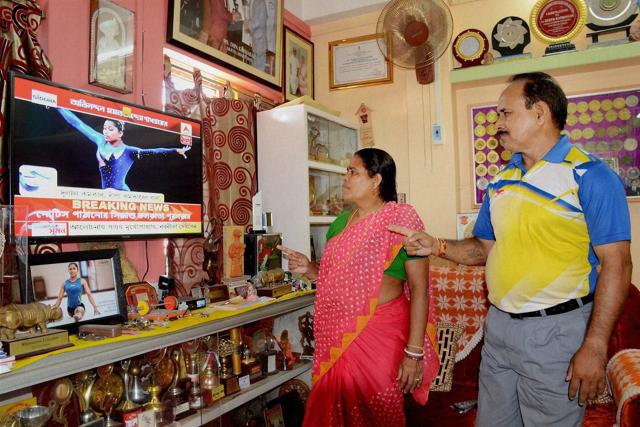 Dipa Karmakar's parents watch her performance at Rio Olympics in their residence at Agartala on Monday. (PTI Photo)