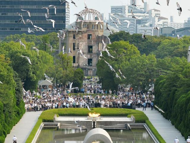 People play Pokemon Go near the Atomic Bomb Dome at Hiroshima Peace Memorial Park in Hiroshima, Japan.(AP Photo)