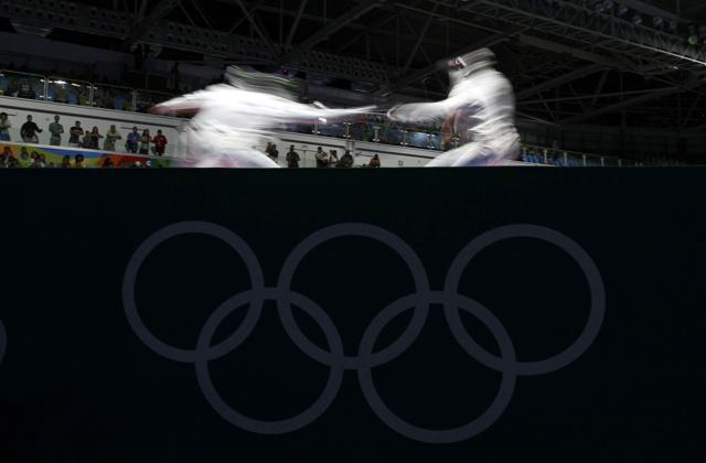 2016 Rio Olympics - Fencing - Preliminary - Men's Epee Individual Table of 64 - Carioca Arena 3 - Rio de Janeiro, Brazil - 09/08/2016. Abdulaziz Alshatti (IOA) of Independent Olympic Athlete competes with Andras Redli (HUN) of Hungary. (REUTERS) 2016 Rio Olympics - Fencing - Preliminary - Men's Epee Individual Table of 64 - Carioca Arena 3 - Rio de Janeiro, Brazil - 09/08/2016. Abdulaziz Alshatti (IOA) of Independent Olympic Athlete competes with Andras Redli (HUN) of Hungary. (REUTERS)