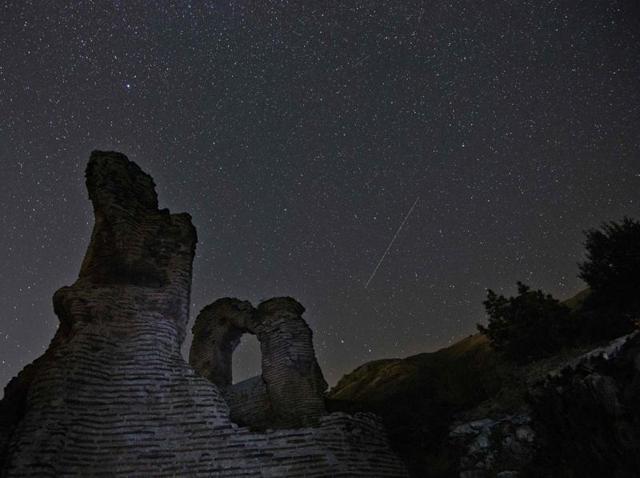 A Perseids meteor streaking across the night sky over the remains of St. Ilia Roman basilica near the town of Pirdop. (AFP File Photo) A Perseids meteor streaking across the night sky over the remains of St. Ilia Roman basilica near the town of Pirdop. (AFP File Photo)