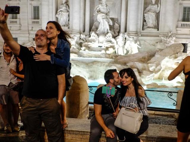 People take selfie pictures in front of the Trevi Fountain, downtown Rome. (AFP) People take selfie pictures in front of the Trevi Fountain, downtown Rome. (AFP)