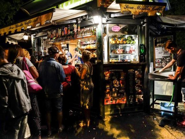 People queue in front of a kiosk to buy a "Grattachecca" (slush ice) in downtown Rome. (AFP) People queue in front of a kiosk to buy a "Grattachecca" (slush ice) in downtown Rome. (AFP)