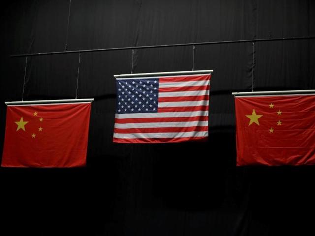 The Chinese flag has five stars in the top left hand corner -- a large one with four smaller ones to its right. The small stars are meant to circle and point to the main star but an inaccurate version used in shooting and swimming medal ceremonies had the little ones parallel to each other. (USA TODAY Photo) The Chinese flag has five stars in the top left hand corner -- a large one with four smaller ones to its right. The small stars are meant to circle and point to the main star but an inaccurate version used in shooting and swimming medal ceremonies had the little ones parallel to each other. (USA TODAY Photo)
