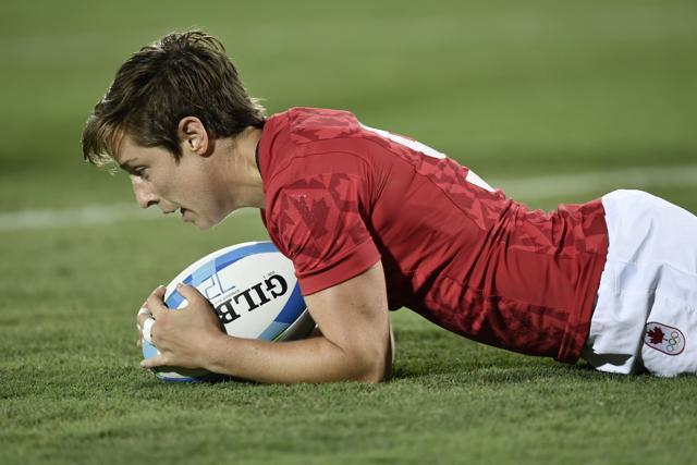 Canada's Ghislaine Landry scores a try against Great Britain. Canada won the bronze medal match. (AFP) Canada's Ghislaine Landry scores a try against Great Britain. Canada won the bronze medal match. (AFP)