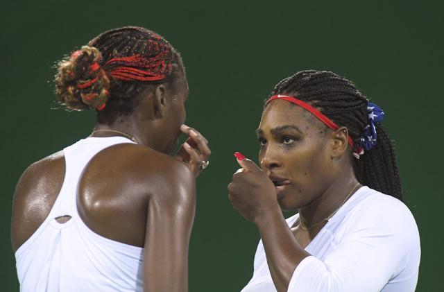 Champion style: Serena Williams and Venus Williams during their match. (Reuters) Champion style: Serena Williams and Venus Williams during their match. (Reuters)