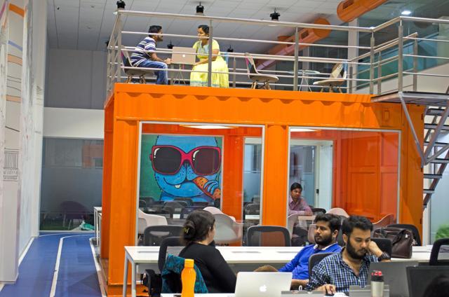 A glass-front metal container acts as a meeting room at Garage (Photo: Garage) A glass-front metal container acts as a meeting room at Garage (Photo: Garage)