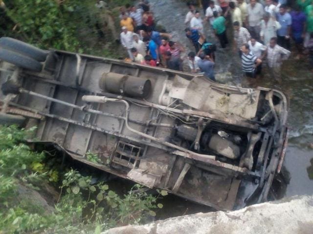 The turned school bus after the accident in Jammu district on Wednesday.(HT Photo)