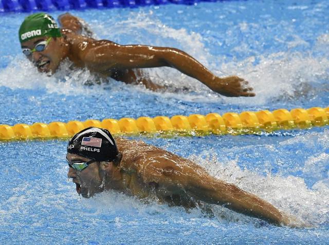 South Africa's Chad Le Clos (top), the 2012 Olympic champion, tries to catch Phelps. (AP Photo)