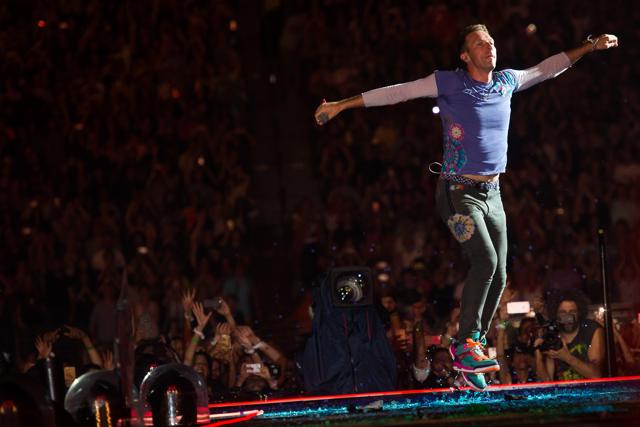 Chris Martin from the band Coldplay performs at MetLife Stadium. (Charles Sykes/Invision/AP)