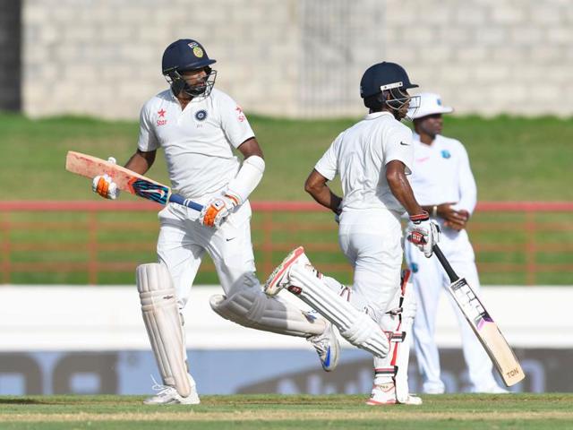 R Ashwin (left) and Wriddhiman Saha steadied India with an unbeaten 108-run partnership for the sixth wicket against West Indies on Day I of the third Test. (AFP) R Ashwin (left) and Wriddhiman Saha steadied India with an unbeaten 108-run partnership for the sixth wicket against West Indies on Day I of the third Test. (AFP)