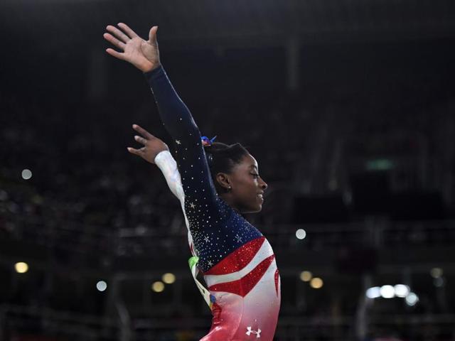 US gymnast Simone Biles competes in the Beam event during the women's team final Artistic Gymnastics. (AFP) US gymnast Simone Biles competes in the Beam event during the women's team final Artistic Gymnastics. (AFP)
