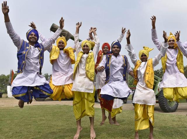 BHANGRA HERE TOO! Youngsters display bhangra at an exhibition ’Know Our Forces’ organised by the Indian Army at Panther Stadium in the cantonment area of Amritsar on Wednesday. (Gurpreet Singh/HT Photo)
