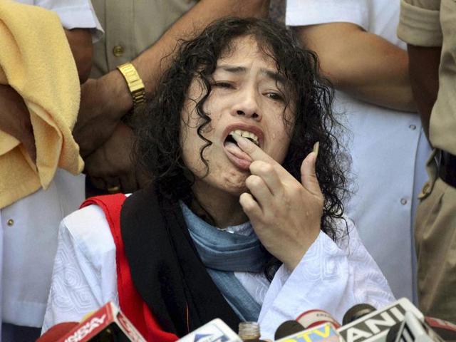 Irom Sharmila licks honey from her hand to break her fast during a press conference in Imphal. (PTI Photo) Irom Sharmila licks honey from her hand to break her fast during a press conference in Imphal. (PTI Photo)