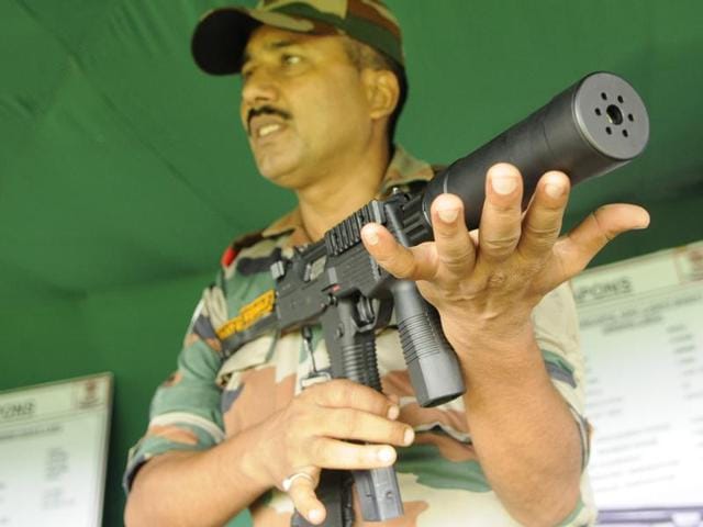 An army officer shows a Swiss-made SMG MP - 9mm machine pistol during the exhibition in Kolkata. (Subhendu Ghosh/HT Photo) An army officer shows a Swiss-made SMG MP - 9mm machine pistol during the exhibition in Kolkata. (Subhendu Ghosh/HT Photo)