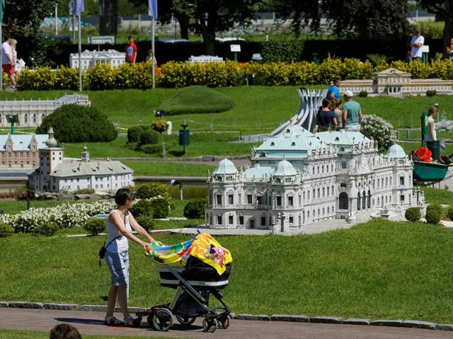 Some of the models include monuments such as Taj Mahal, Statue of Liberty, Tower of London and Sydney Opera House. A woman pushes a pram in front of a model of Vienna's Belvedere Palace. (REUTERS) Some of the models include monuments such as Taj Mahal, Statue of Liberty, Tower of London and Sydney Opera House. A woman pushes a pram in front of a model of Vienna's Belvedere Palace. (REUTERS)