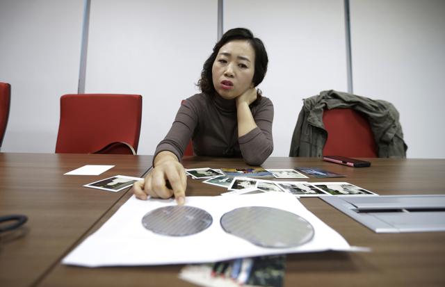Park Min-sook explains how silicon wafers are used in the semiconductor process, during an interview in Seoul, South Korea. (AP Photo) Park Min-sook explains how silicon wafers are used in the semiconductor process, during an interview in Seoul, South Korea. (AP Photo)