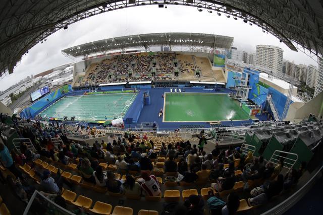 In this picture taken with a fish-eye lens, the water of the diving pool at right appears a murky green as a men's water polo preliminary round match between Greece and Hungary takes place at left in the Maria Lenk Aquatic Center at the 2016 Summer Olympics in Rio de Janeiro on Wednesday (AP) In this picture taken with a fish-eye lens, the water of the diving pool at right appears a murky green as a men's water polo preliminary round match between Greece and Hungary takes place at left in the Maria Lenk Aquatic Center at the 2016 Summer Olympics in Rio de Janeiro on Wednesday (AP)