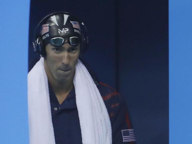 Game face on! Phelps arrives for the final of the men's 200-metre butterfly final. (AP photo)