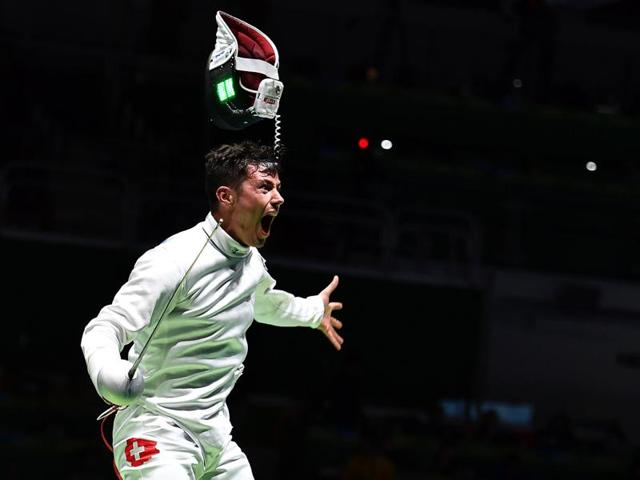 Switzerland's Fabian Kauter reacts to winning against Ukraine's Anatoliy Herey during their men’s individual epee qualifying bout as part of the fencing event. (AFP) Switzerland's Fabian Kauter reacts to winning against Ukraine's Anatoliy Herey during their men’s individual epee qualifying bout as part of the fencing event. (AFP)