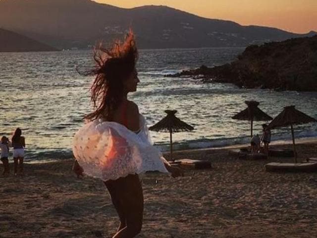 Lisa enjoys the breeze on a Greek beach.