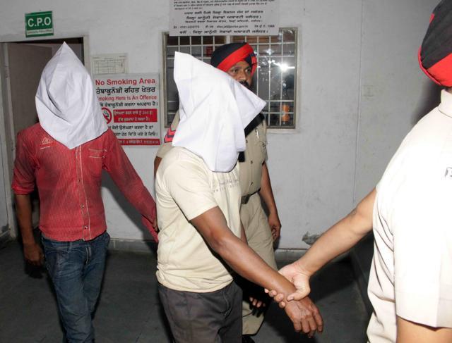 The suspects being taken into custody. (HT Photo)