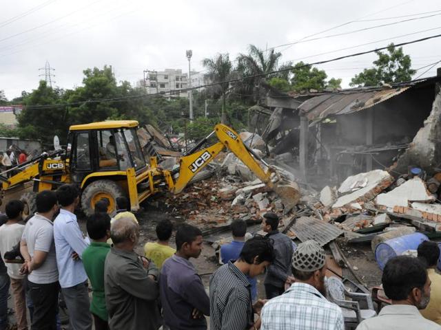 A BMC poclain demolishes an enroachment in Bhopal’s Lalghati area on Wednesday. (Mujeeb Faruqui/HT photo) A BMC poclain demolishes an enroachment in Bhopal’s Lalghati area on Wednesday. (Mujeeb Faruqui/HT photo)