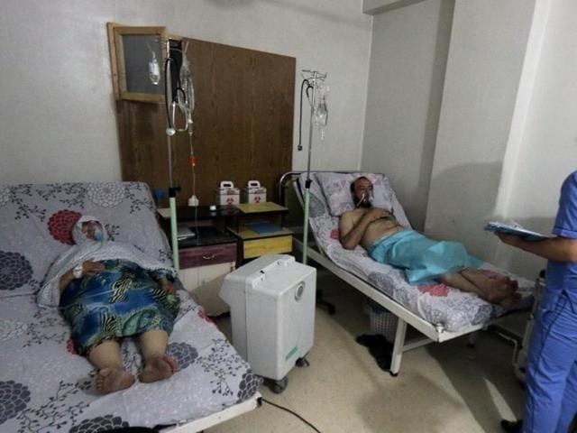 Civilians breathe through oxygen masks at al-Quds hospital, after a hospital and a civil defence group said a gas, what they believed to be chlorine, was dropped alongside barrel bombs on a neighbourhood in Aleppo early on Thursday. (Reuters)