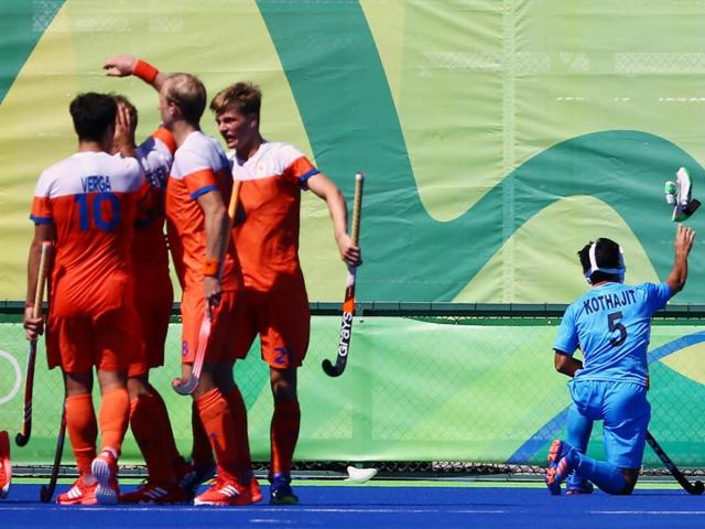 Netherlands celebrate their second goal while Kothajit Singh Khadangbam of India (R) reacts. (REUTERS) Netherlands celebrate their second goal while Kothajit Singh Khadangbam of India (R) reacts. (REUTERS)