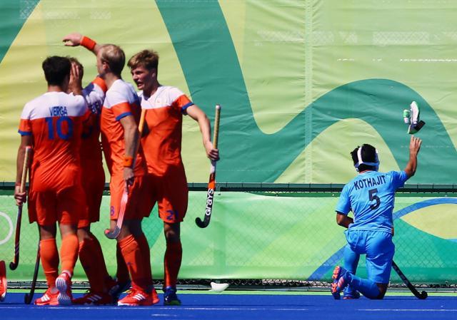 Netherlands celebrate their second goal while Kothajit Singh Khadangbam of India (R) reacts. (REUTERS) Netherlands celebrate their second goal while Kothajit Singh Khadangbam of India (R) reacts. (REUTERS)
