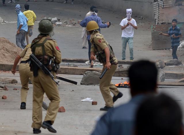 Protestors throw stones at security forces during a clash in downtown Srinagar on August 10. (AFP) Protestors throw stones at security forces during a clash in downtown Srinagar on August 10. (AFP)