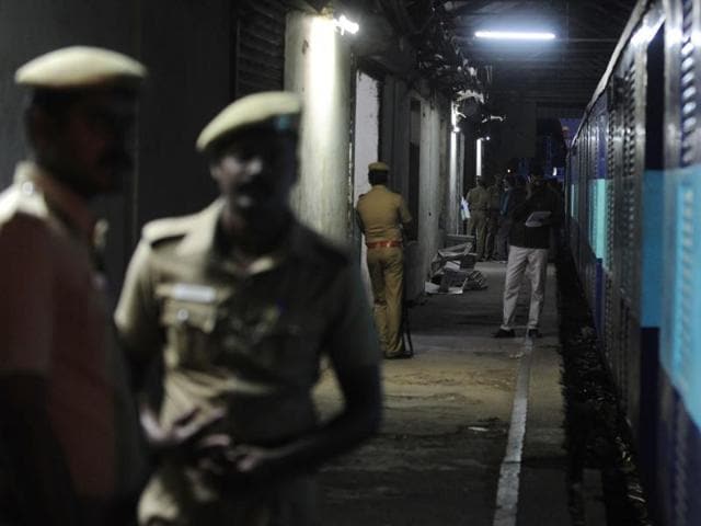 Police personnel stand guard alongside the Salem-Chennai Express train, which was robbed while in transit, at Egmore railway station in Chennai. (AFP Photo) Police personnel stand guard alongside the Salem-Chennai Express train, which was robbed while in transit, at Egmore railway station in Chennai. (AFP Photo)
