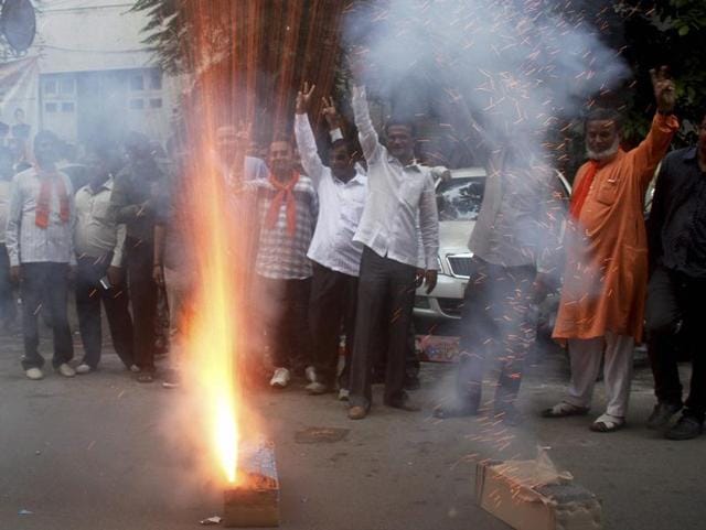 BJP supporters celebrate after Jitu Vaghani was appointed the new Gujarat BJP chief at party office in Ahmedabad.(PTI Photo)