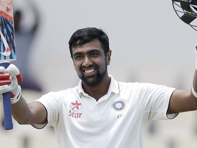 India's Ravichandran Ashwin celebrates after he scored a century against West Indies.(AP Photo)