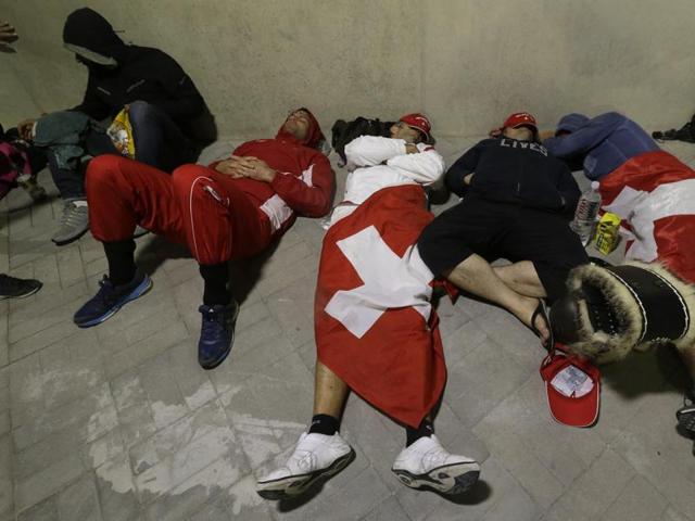 Who said Brazil is unsafe? These Swiss fans surely feel safe sleeping outside a venue. (AP)