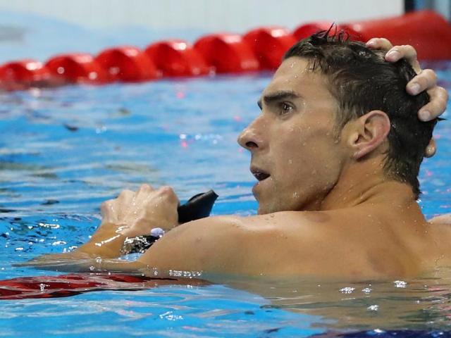 United States' Michael Phelps celebrates winning a semifinal of the men's 200-meter individual medley. (AP Photo) 