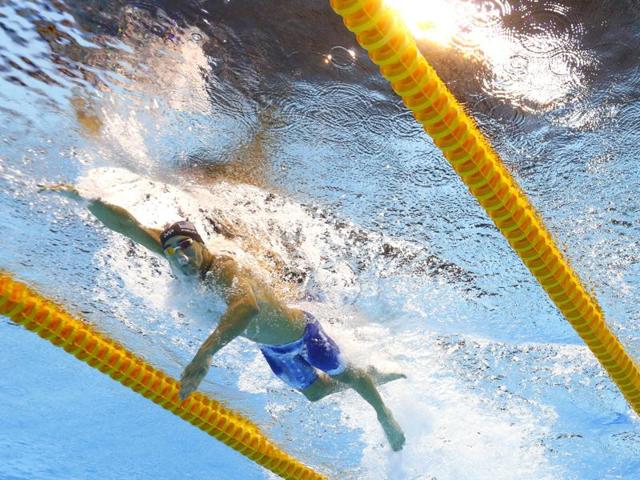 United States' Michael Phelps, left, and Ryan Lochte compete in a semifinal of the men's 200-meter individual medley during the swimming competitions. (AP Photo) 