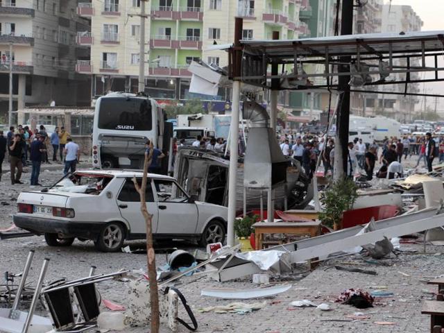 Police search an area after a bomb attack in Mardin, Turkey.(AP Photo)