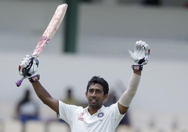 Wriddhiman Saha celebrates after scoring his maiden century . (AP Photo) Wriddhiman Saha celebrates after scoring his maiden century . (AP Photo)