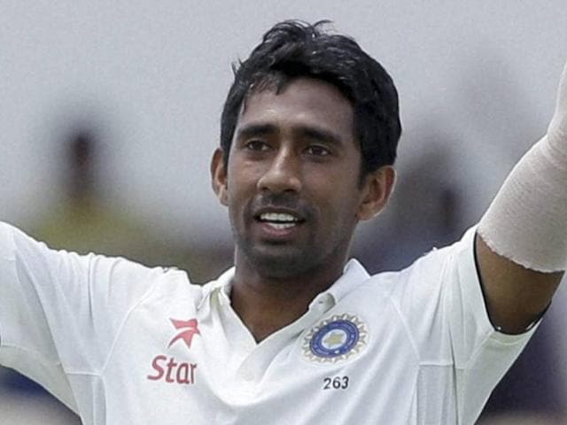 India's wicketkeeper Wriddhiman Saha celebrates after he scored a century against West Indies. (AP Photo) India's wicketkeeper Wriddhiman Saha celebrates after he scored a century against West Indies. (AP Photo)