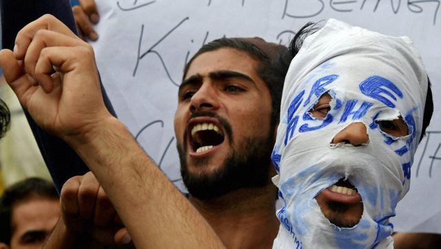 Residents of Tengpora shouts slogans during a protest in Srinagar on Wednesday, demanding arrest of DSP Yasir Qadri who allegedly killed Shabir Ahmad Mir inside his house. (PTI file photo) Residents of Tengpora shouts slogans during a protest in Srinagar on Wednesday, demanding arrest of DSP Yasir Qadri who allegedly killed Shabir Ahmad Mir inside his house. (PTI file photo)