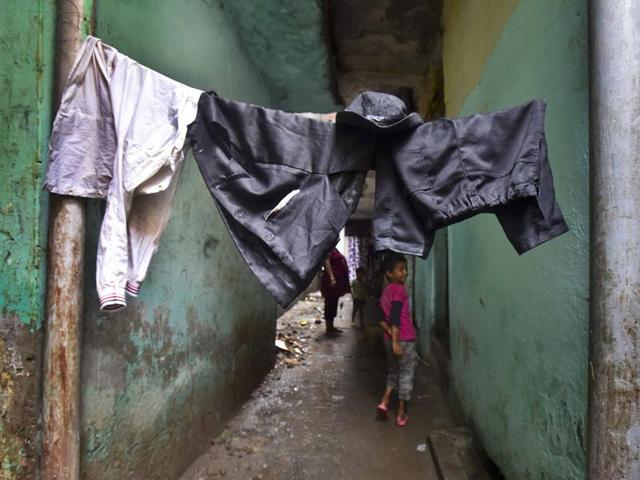 Monu's 'Charlie Chaplin' dress dries on a washing line in the dingy lanes of his rented accommodation. By evening, these clothes transform Monu completely, turning him into an avatar of Charlie Chaplin. (Raj K Raj/HT PHOTO)