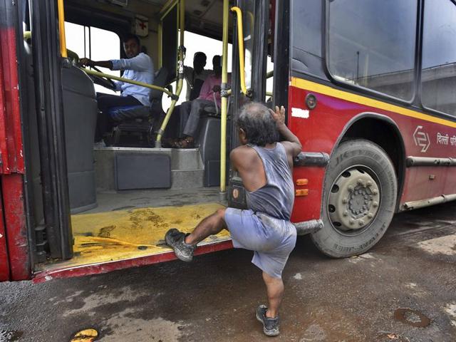 Every morning, Monu boards a DTC bus early on in the day, from the Nizzamuddin bus stand. Public transport, just like some people, can be unfriendly to Monu. (Raj K Raj/HT PHOTO)