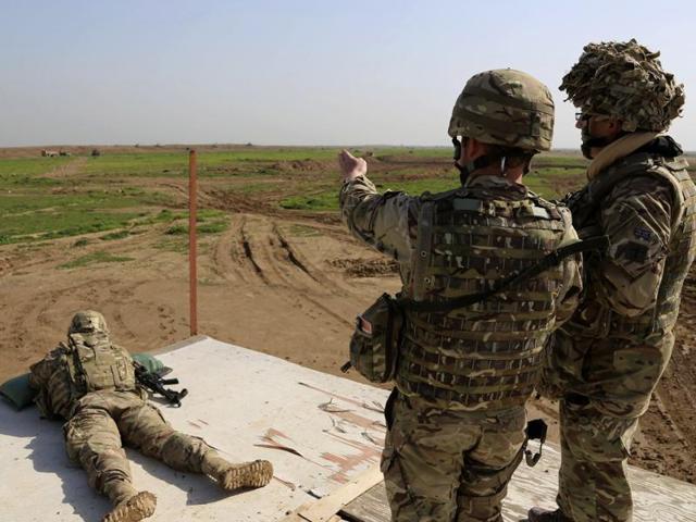 American and Spanish trainers use live ammunition in training exercises at Basmaya base, 40 kilometers southeast of Baghdad, Iraq. (AP File Photo) American and Spanish trainers use live ammunition in training exercises at Basmaya base, 40 kilometers southeast of Baghdad, Iraq. (AP File Photo)