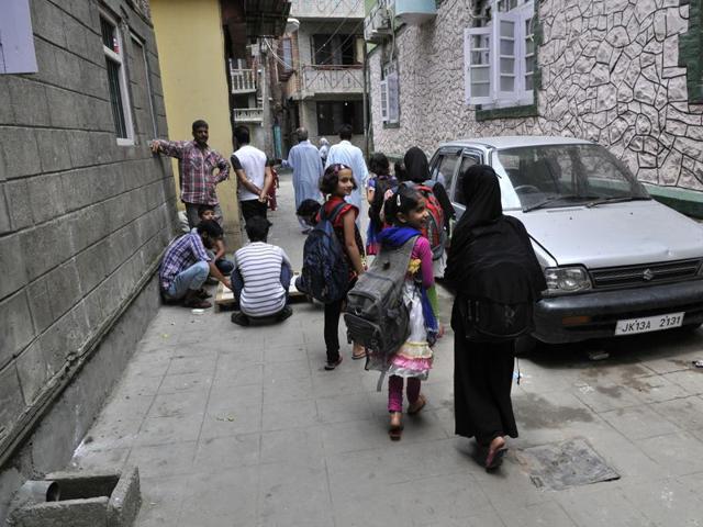 The lanes and by-lanes of Kaw Mohalla in the old areas of Srinagar, which has been under curfew for the past 34 days, are witnessing the joy and laughter of school-going children for the past three days. (Waseem Andrabi / HT Photo)